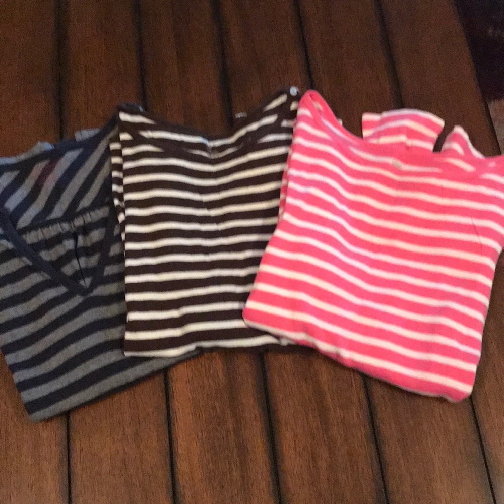 Bundle of long-sleeve women’s shirts.